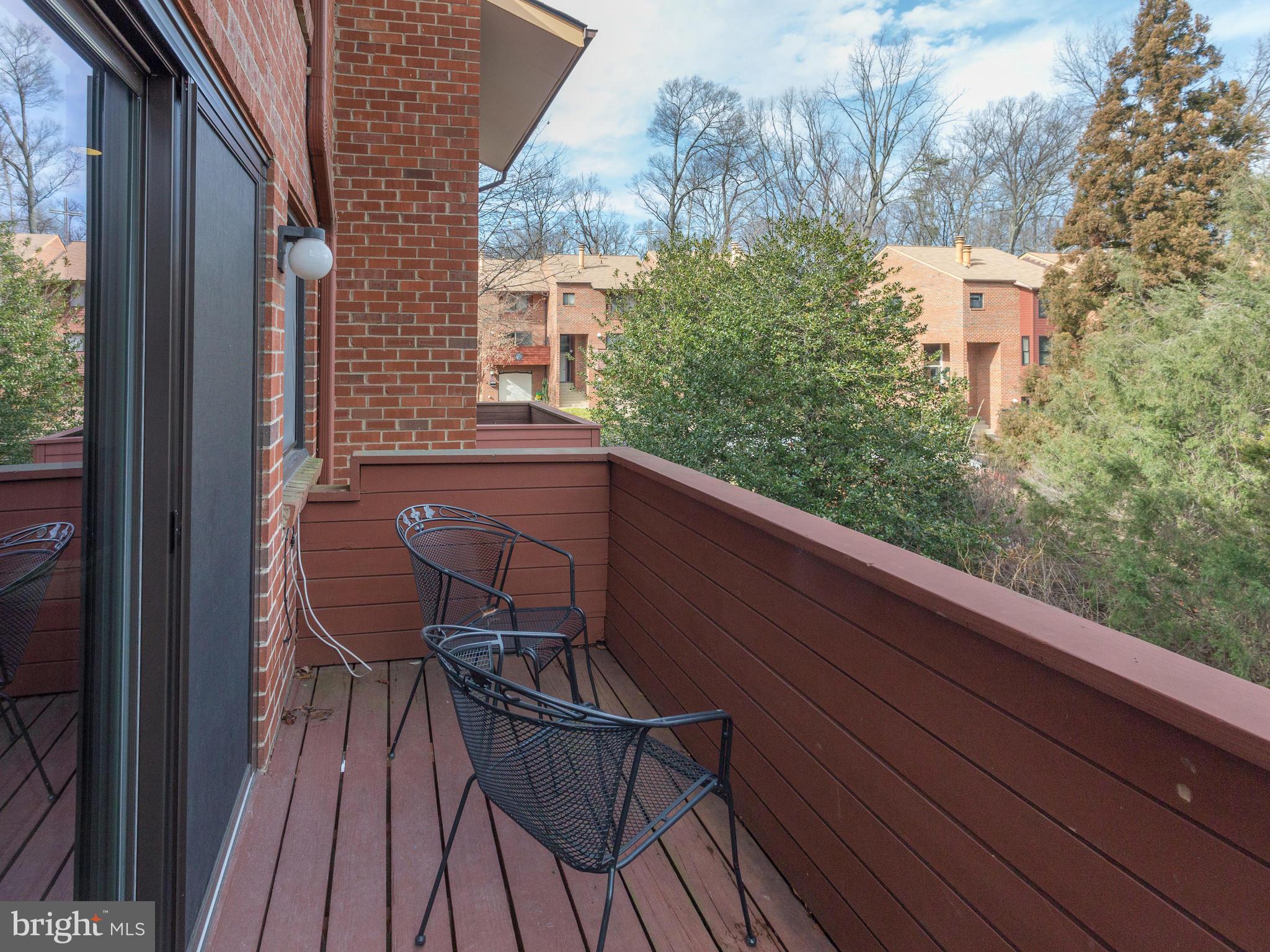 1663 Bachan Court Reston, VA 20190 - Photo 13 of 29 a view of balcony with wooden floor and outdoor seating