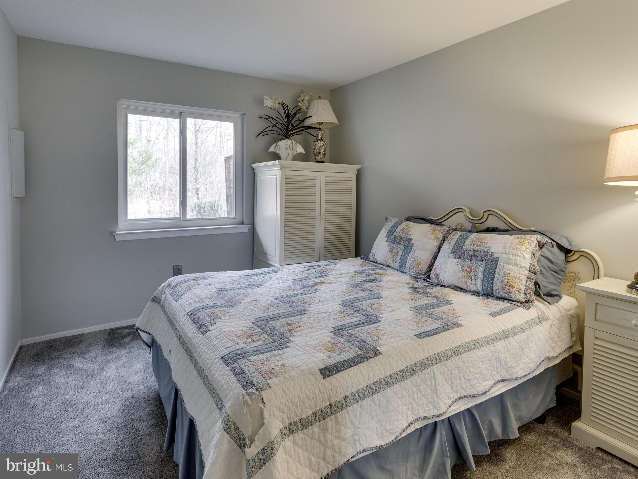 1663 Bachan Court Reston, VA 20190 - Photo 26 of 29 a bedroom with a bed and window