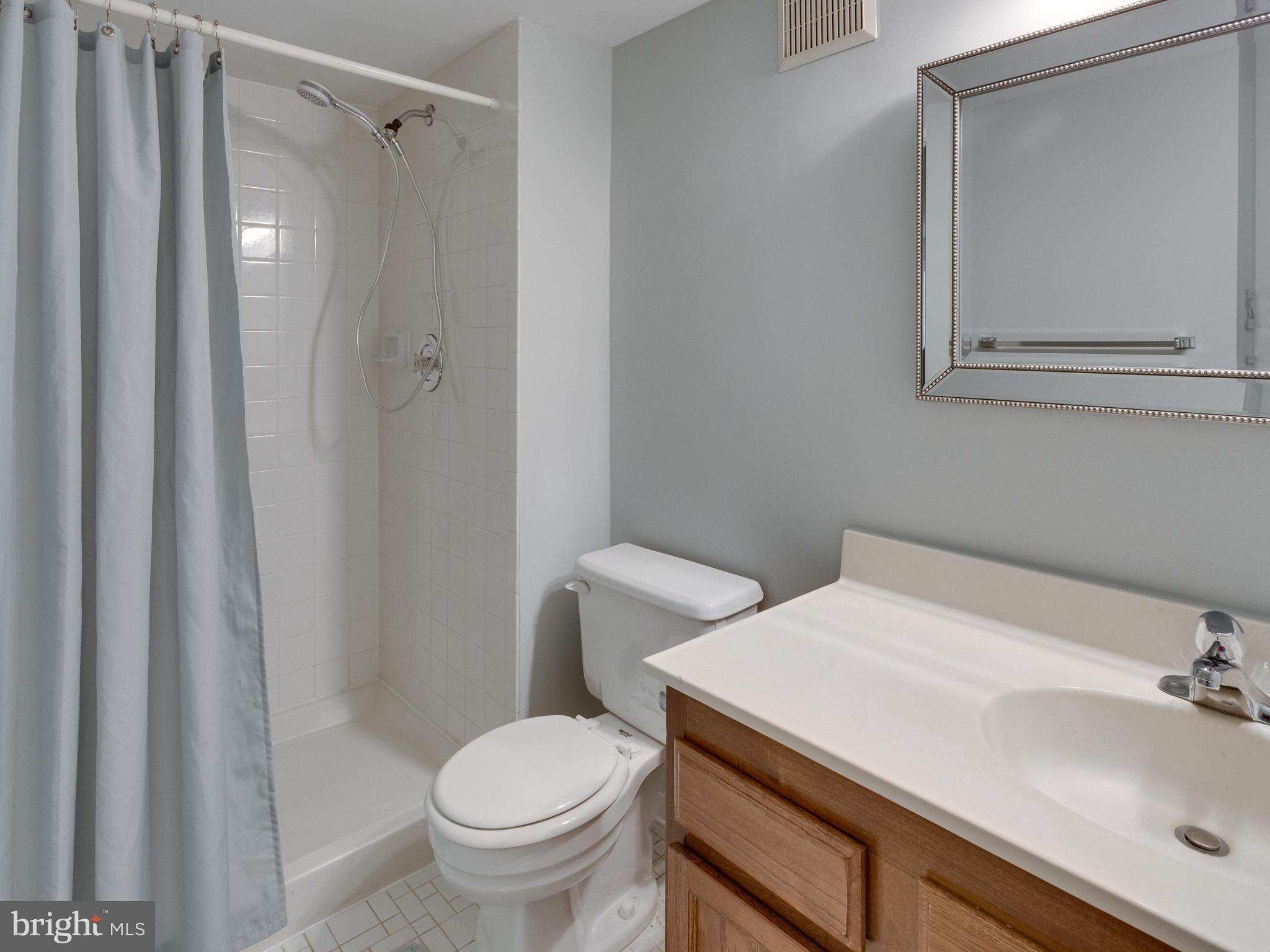 1663 Bachan Court Reston, VA 20190 - Photo 28 of 29 a bathroom with a sink toilet and shower