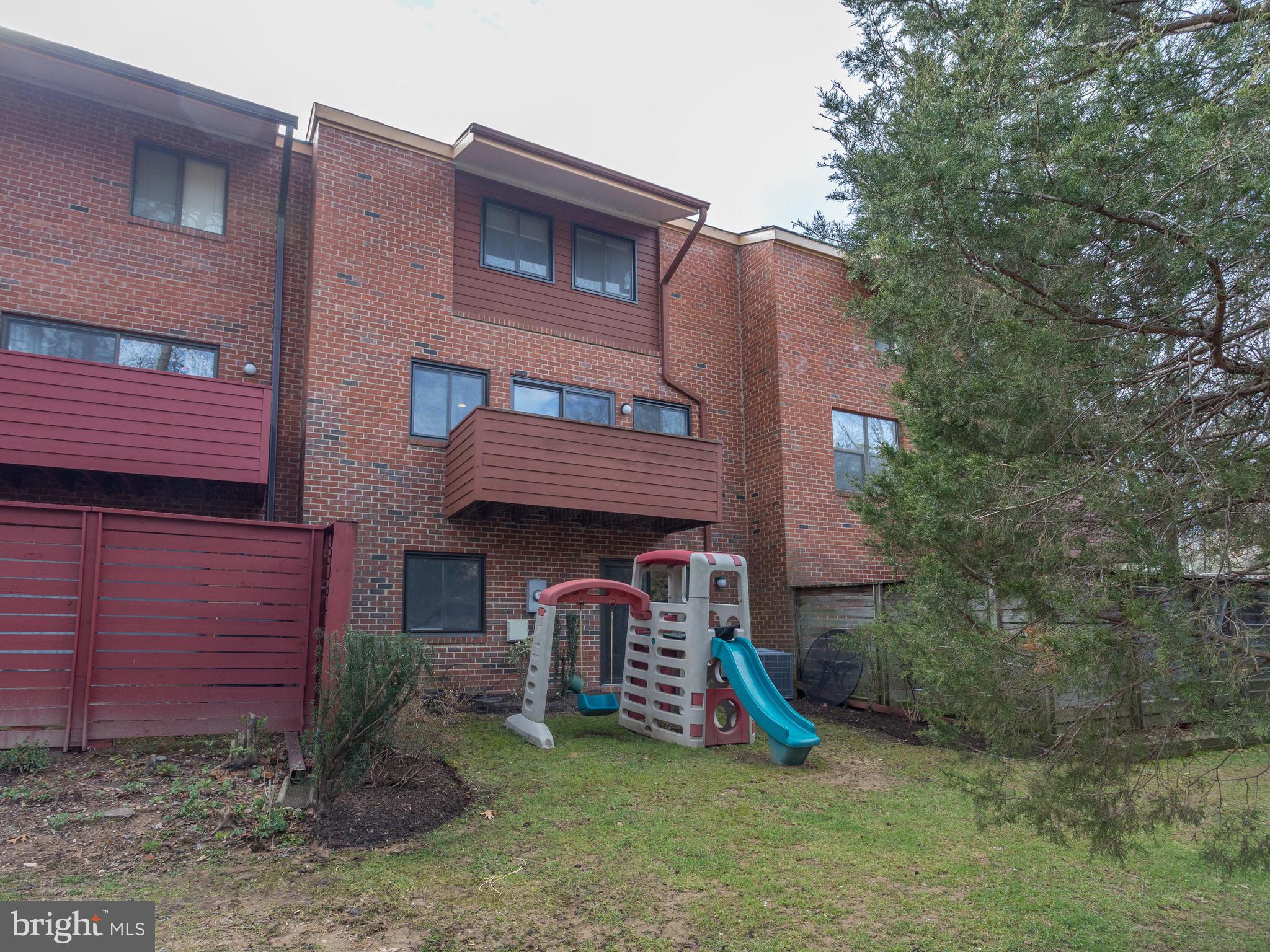 1663 Bachan Court Reston, VA 20190 - Photo 29 of 29 a view of a house with a yard and large tree