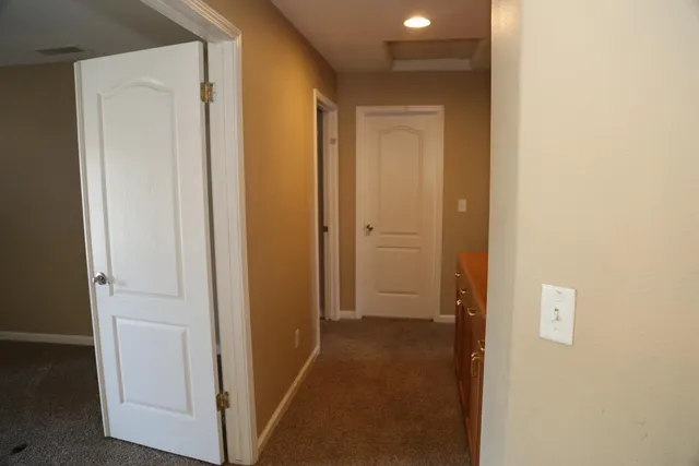 a view of a hallway with closet area