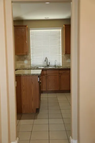 a kitchen with a cabinets and window