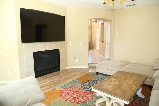 a living room with furniture and a flat screen tv