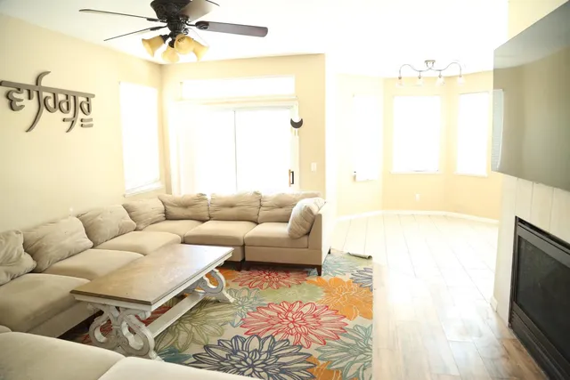 a living room with furniture and a large window
