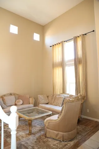 a view of a dining room with furniture and chandelier