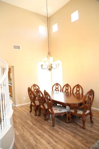 a view of staircase and living room with a large window