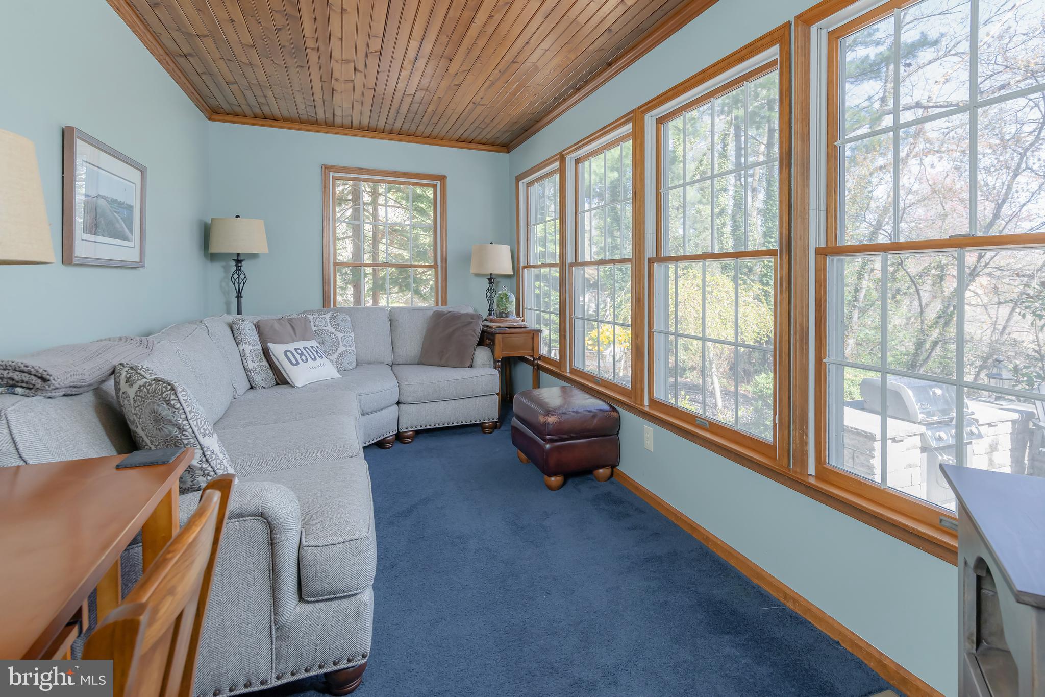 124 Pitman Downer Road Sewell, NJ 08080 - Photo 13 of 71 a living room with furniture and a large window