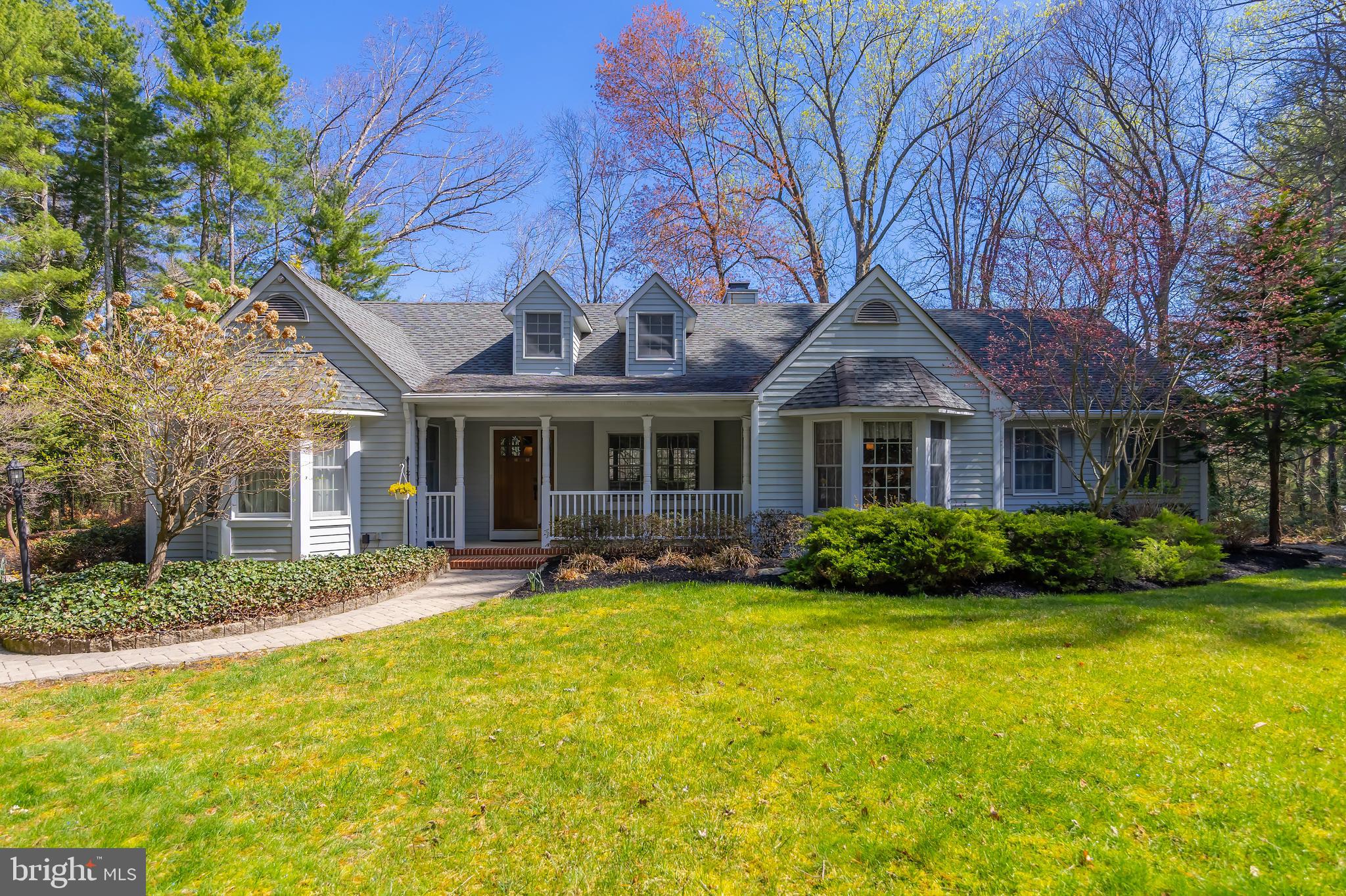 124 Pitman Downer Road Sewell, NJ 08080 - Photo 2 of 71 a front view of a house with garden and porch