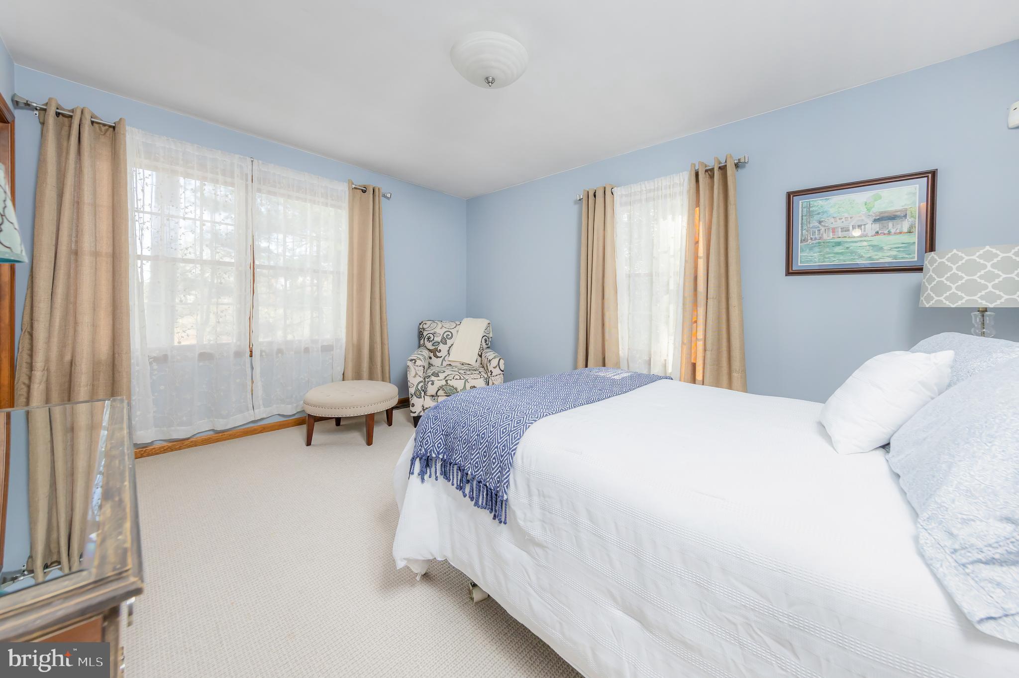 124 Pitman Downer Road Sewell, NJ 08080 - Photo 23 of 71 a bedroom with a bed and a large window