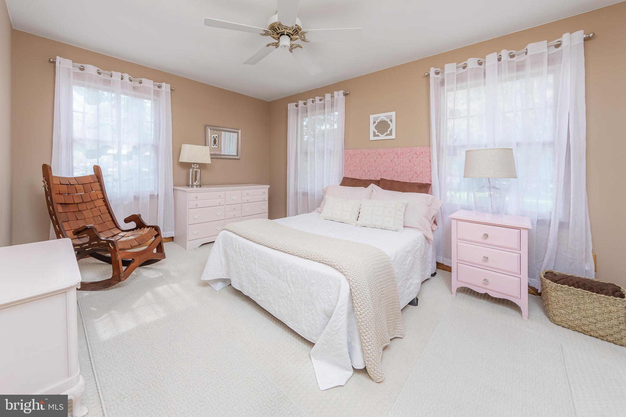 124 Pitman Downer Road Sewell, NJ 08080 - Photo 25 of 71 a spacious bedroom with a bed and a couch