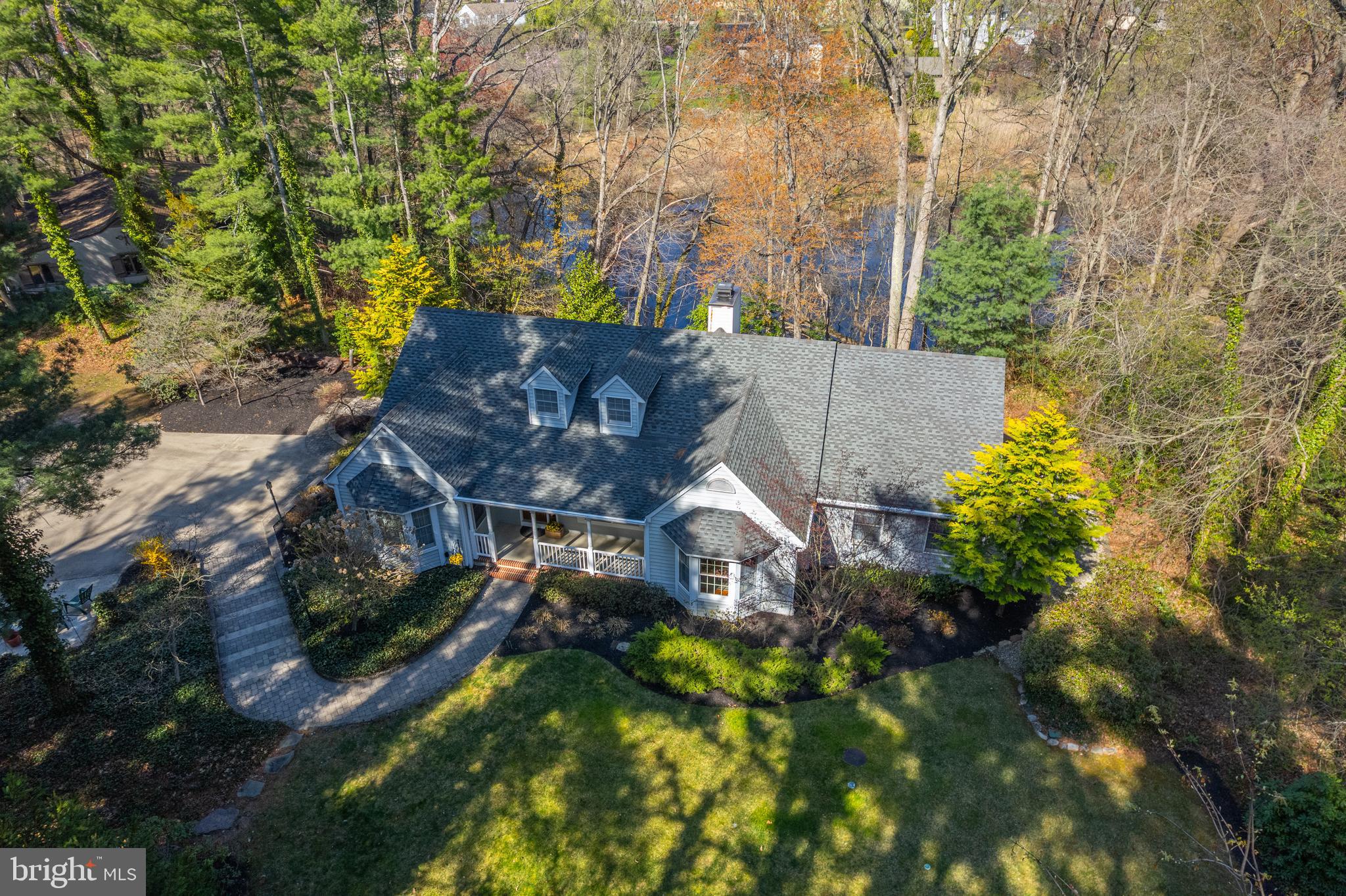 124 Pitman Downer Road Sewell, NJ 08080 - Photo 3 of 71 an aerial view of a house with a yard and large trees