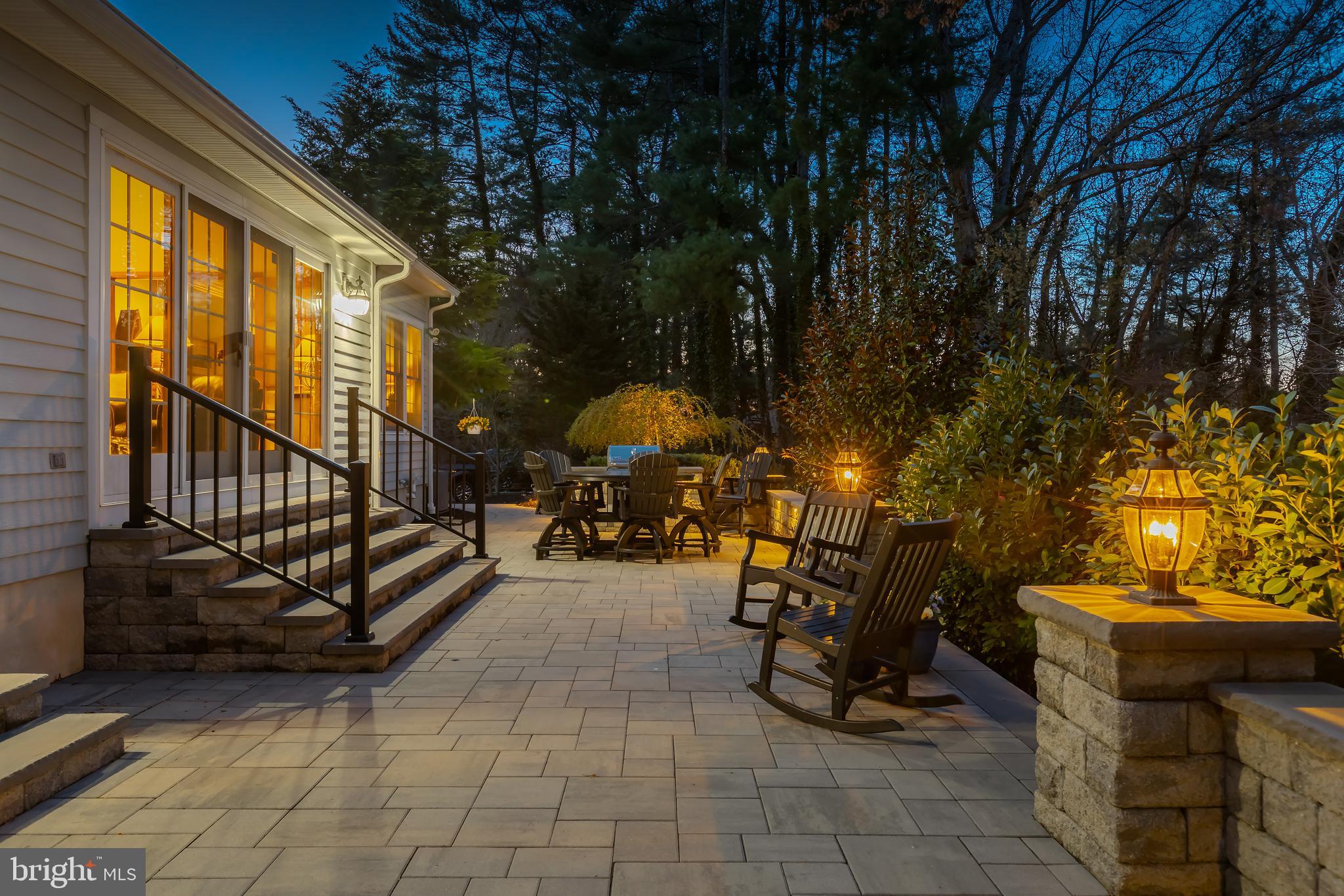 124 Pitman Downer Road Sewell, NJ 08080 - Photo 40 of 71 a view of a patio with table and chairs and potted plants