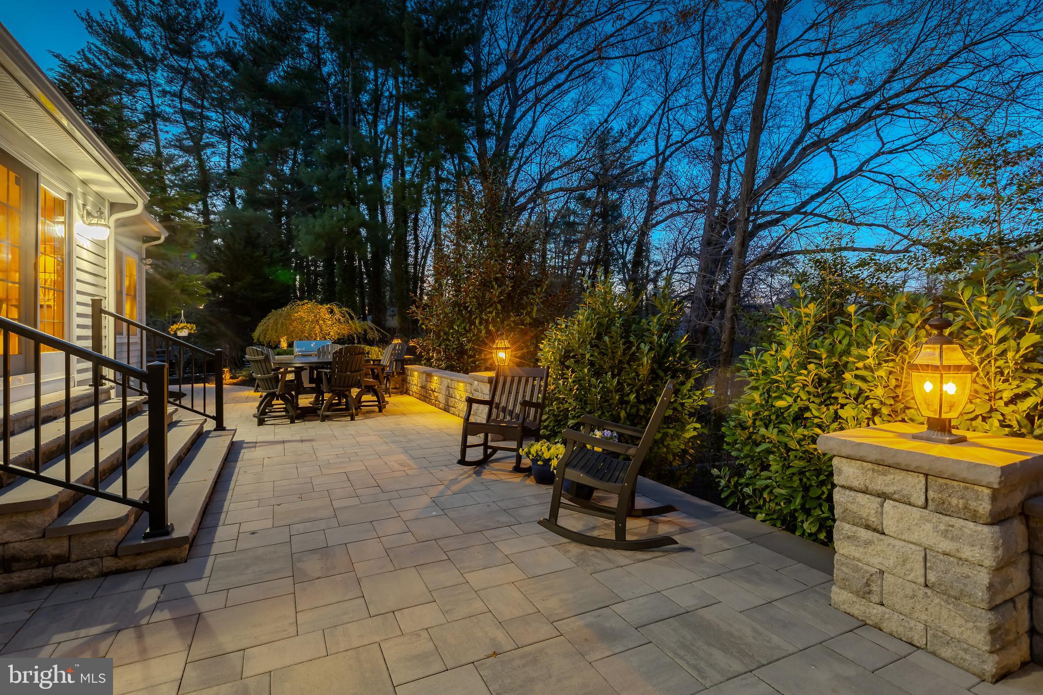 124 Pitman Downer Road Sewell, NJ 08080 - Photo 41 of 71 a view of a patio with table and chairs under an umbrella