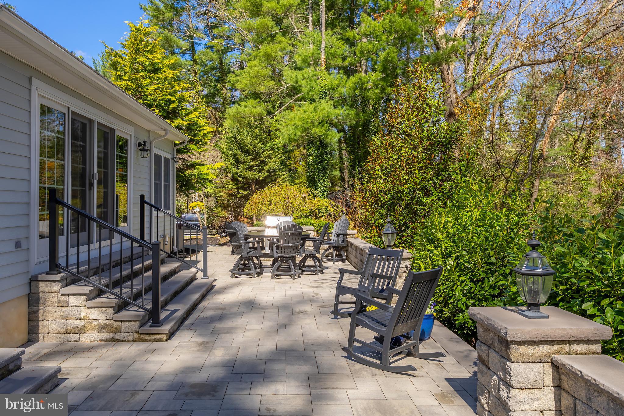 124 Pitman Downer Road Sewell, NJ 08080 - Photo 53 of 71 a view of backyard with a table and chairs and a large tree