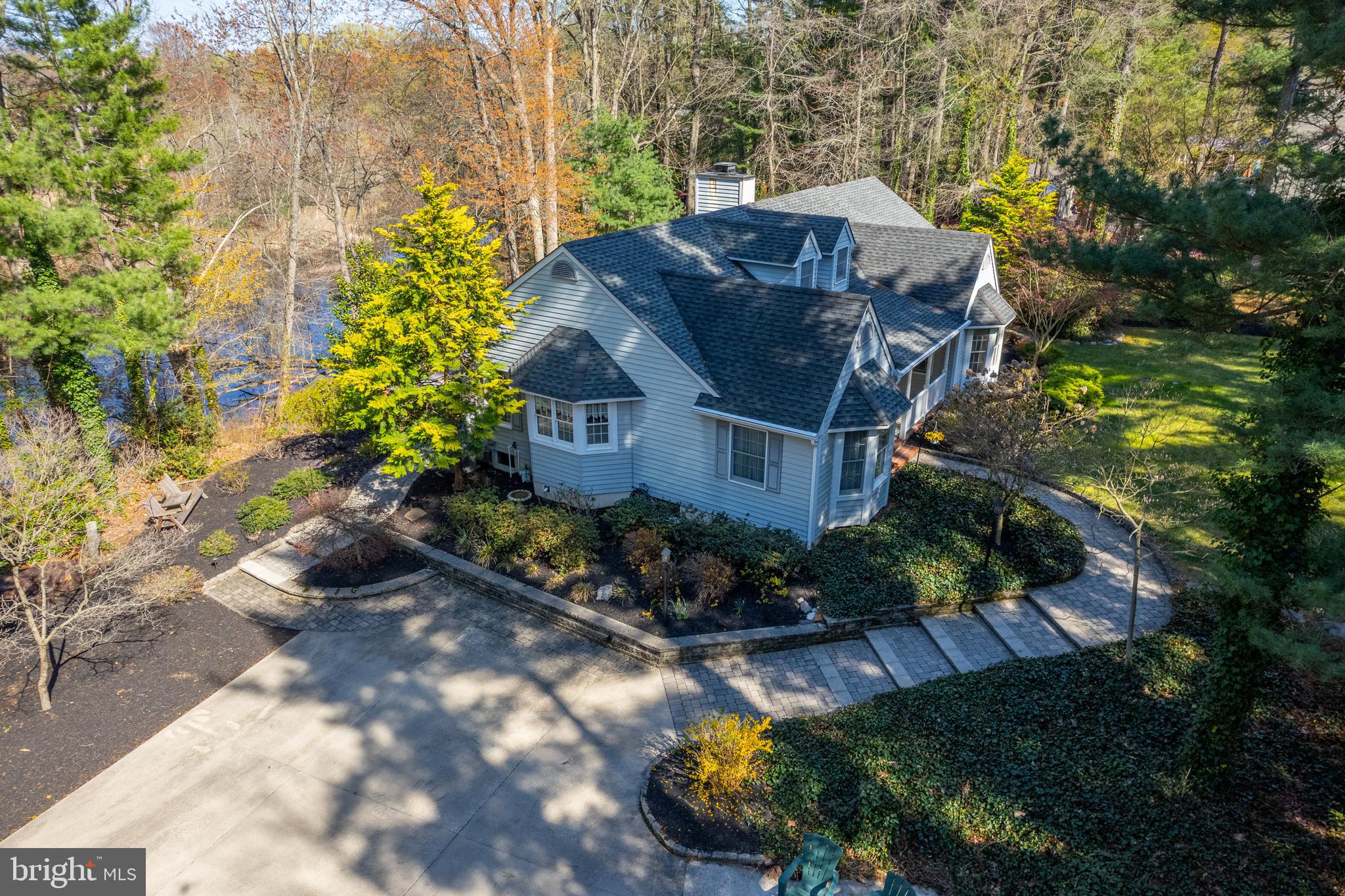 124 Pitman Downer Road Sewell, NJ 08080 - Photo 65 of 71 a view of a house with a yard and garden