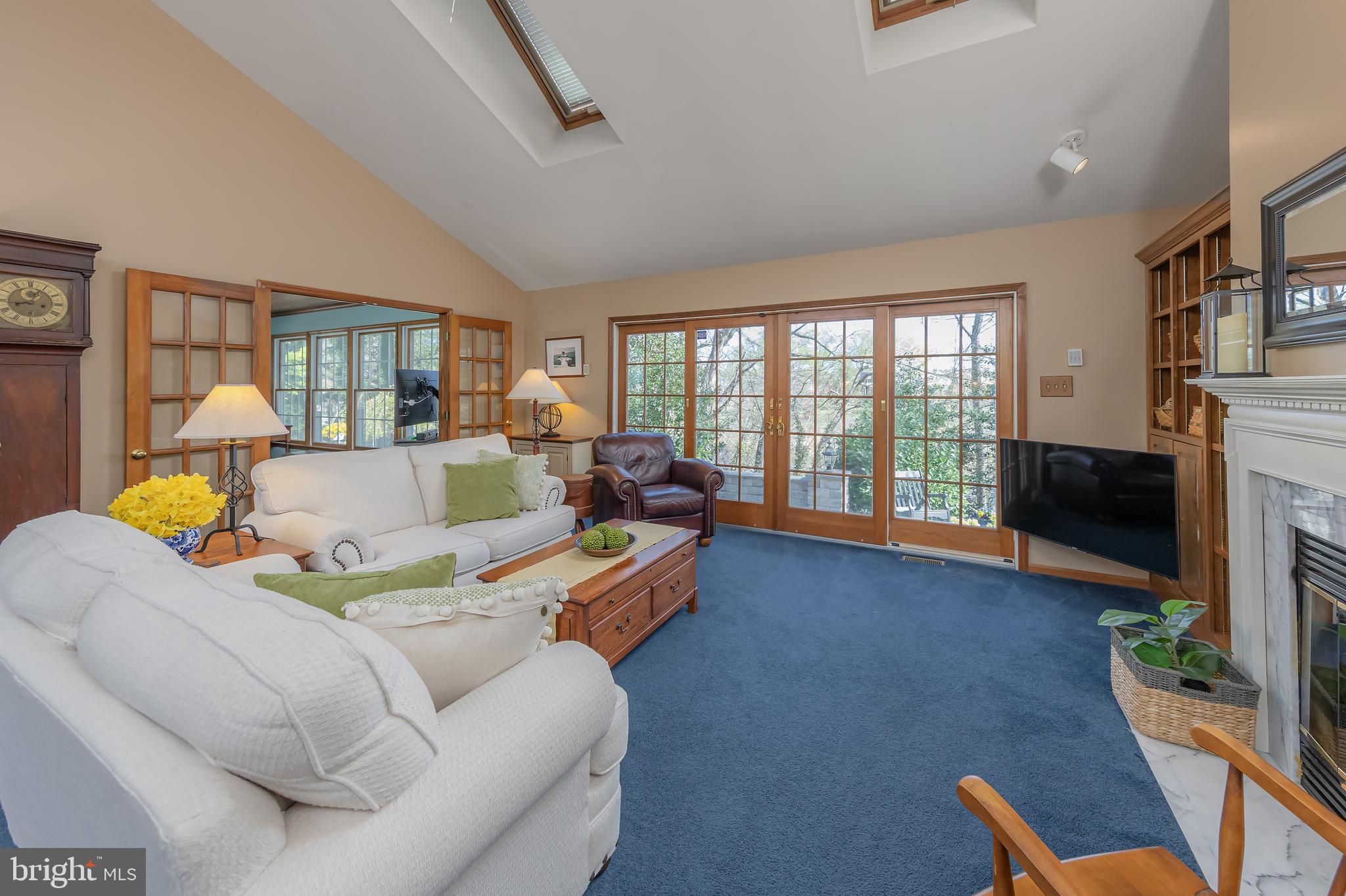 124 Pitman Downer Road Sewell, NJ 08080 - Photo 8 of 71 a living room with furniture a fireplace and a floor to ceiling window
