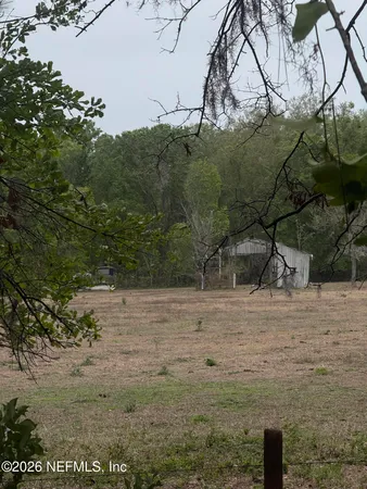 a backyard of a house with lots of green space