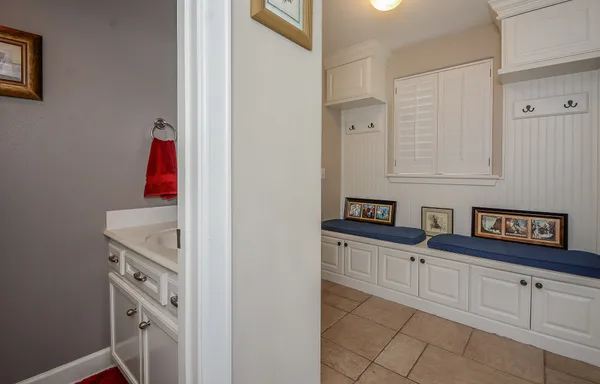 a kitchen with cabinets and white appliances