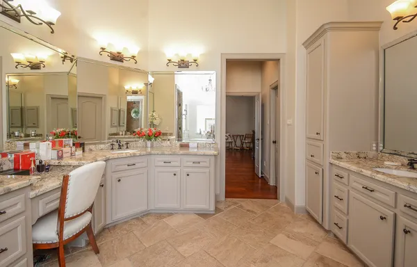 a spacious bathroom with a double vanity sink mirror and