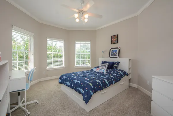 a bedroom with a bed and window