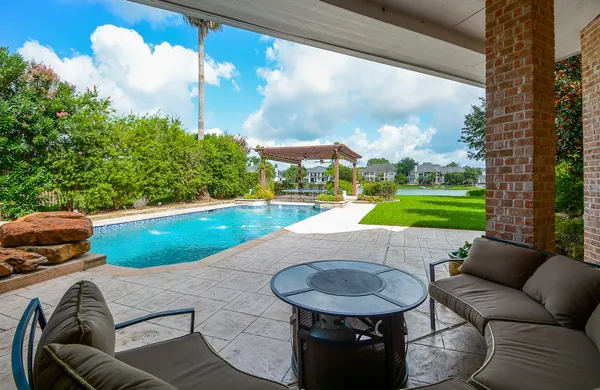 a view of a swimming pool with a patio