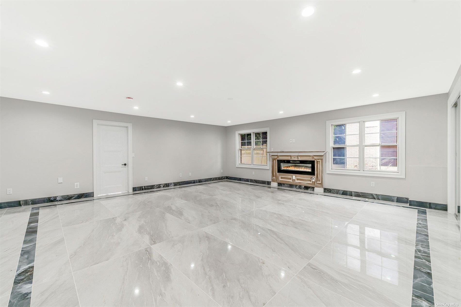 22 Solar Lane Albertson, NY 11507 - Photo 3 of 21 a view of an empty room with a window
