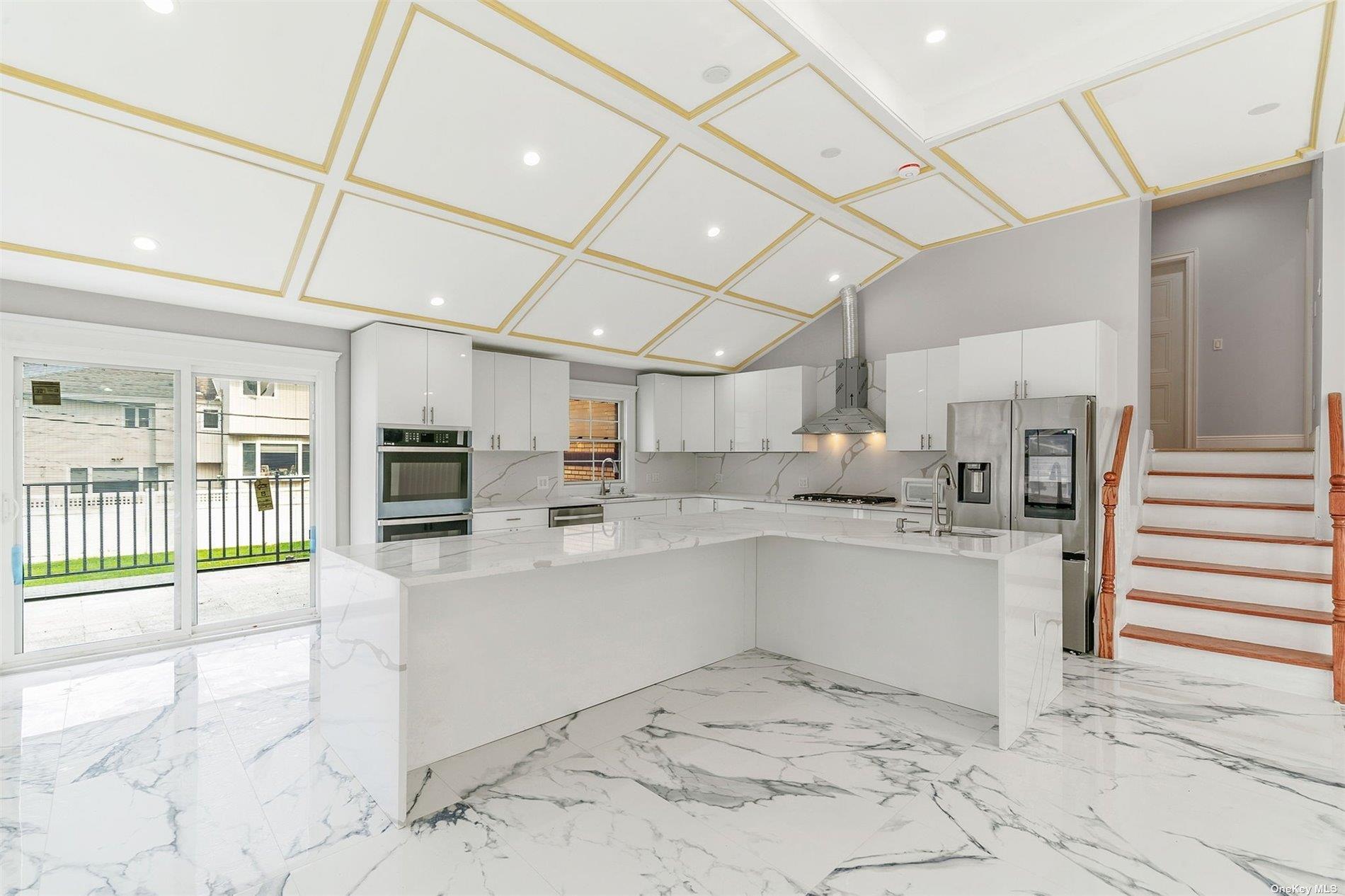 22 Solar Lane Albertson, NY 11507 - Photo 7 of 21 a room with stainless steel appliances kitchen island granite countertop a refrigerator and a sink