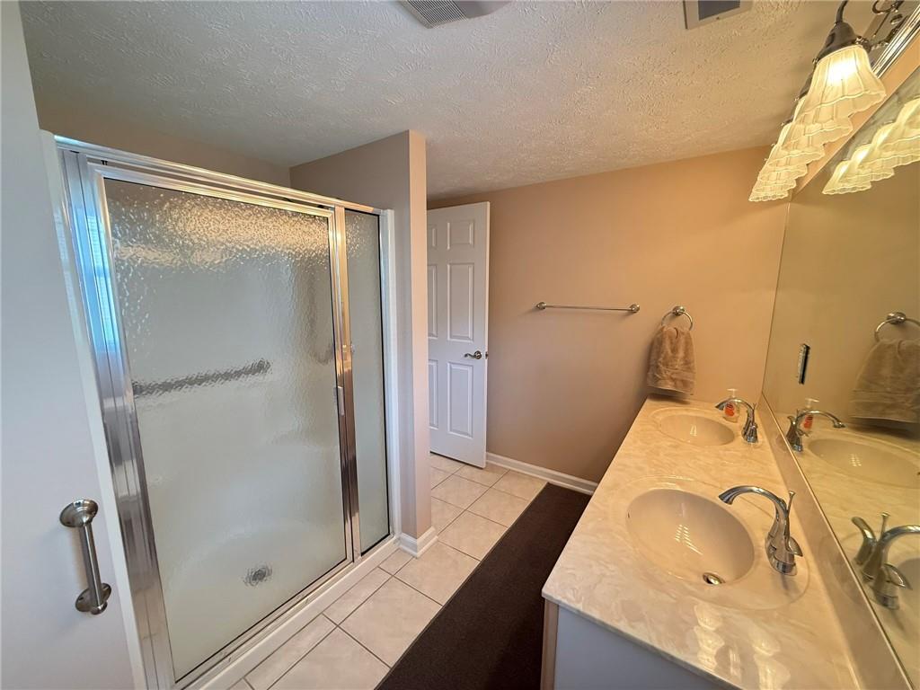 411 Chestnut Lane Apollo, PA 15613 - Photo 12 of 38 a bathroom with a granite countertop sink and a mirror