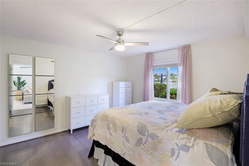 1010 Manatee Road, Unit B101 Naples, FL 34114 - Photo 17 of 26 a bedroom with a bed furniture and a window