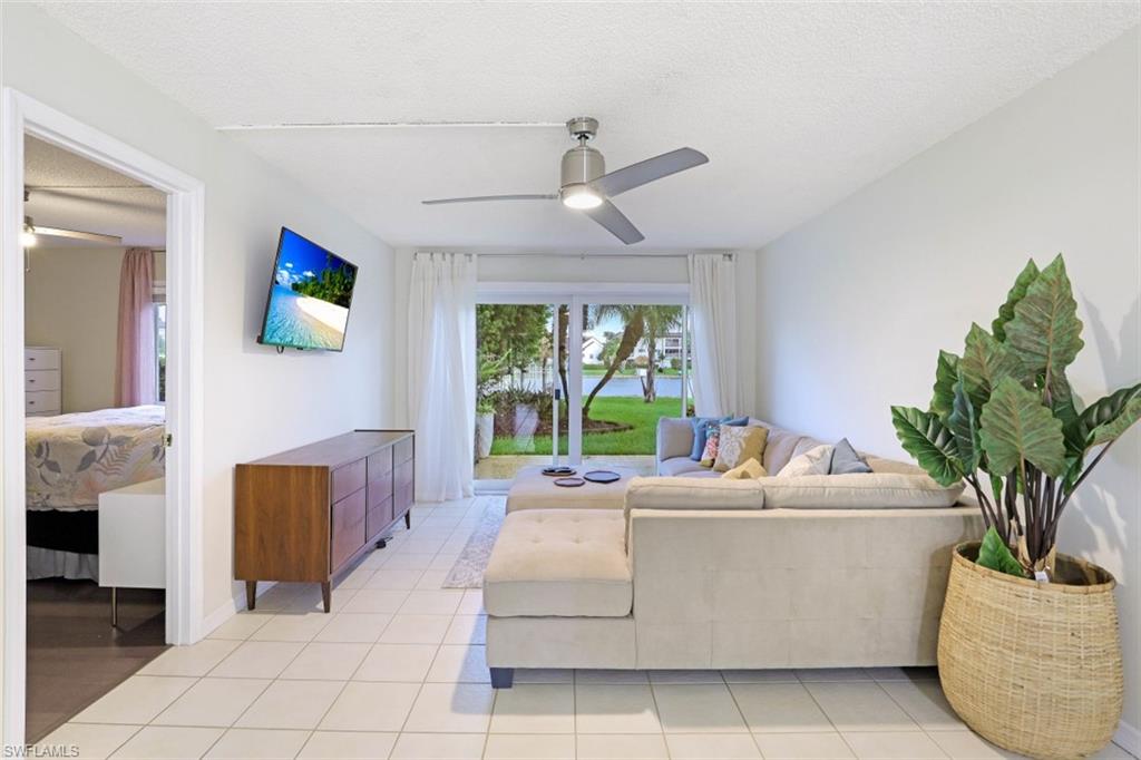 1010 Manatee Road, Unit B101 Naples, FL 34114 - Photo 5 of 26 a living room with furniture and a potted plant