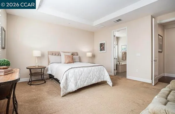 a bedroom with a bed and furniture