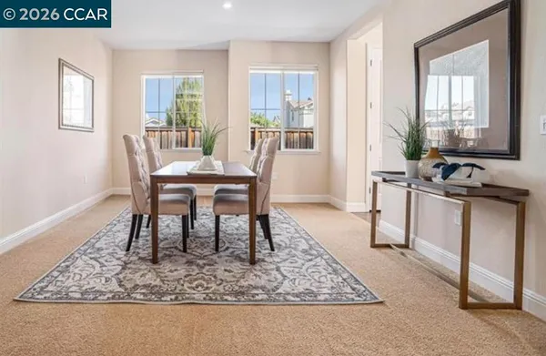 a view of a dining room with furniture