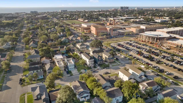 an aerial view of residential building with parking