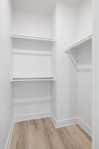 a view of an empty walk in closet