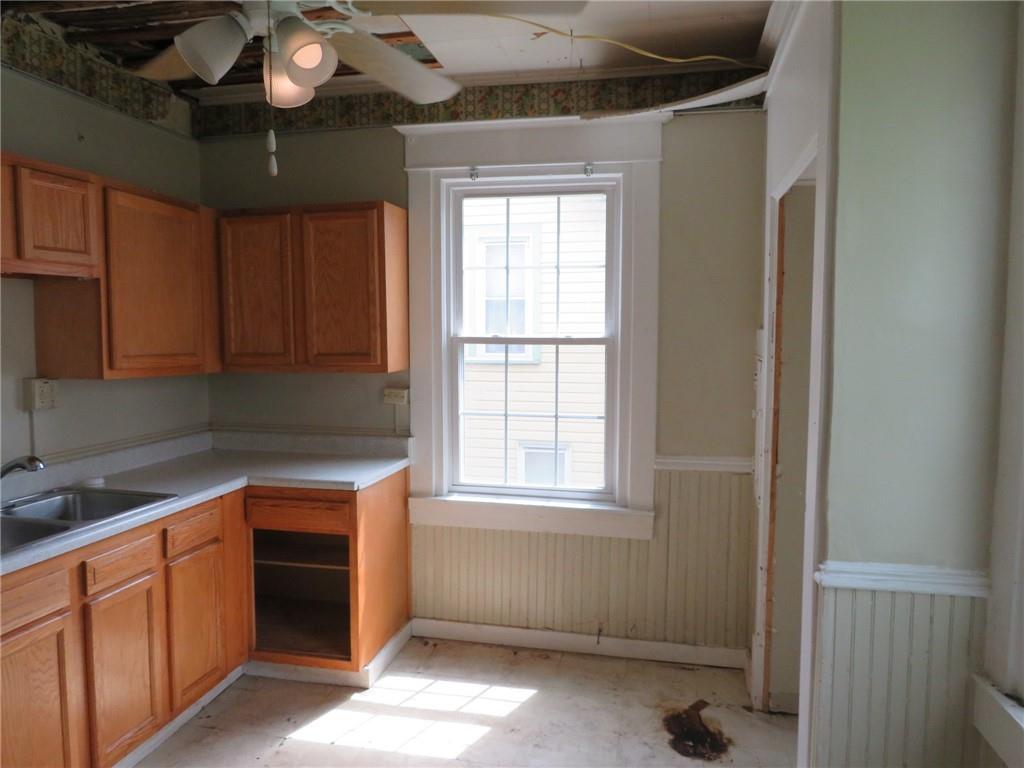 802 Howard Street Monongahela, PA 15063 - Photo 19 of 43 a kitchen with stainless steel appliances granite countertop a sink and cabinets with wooden floor