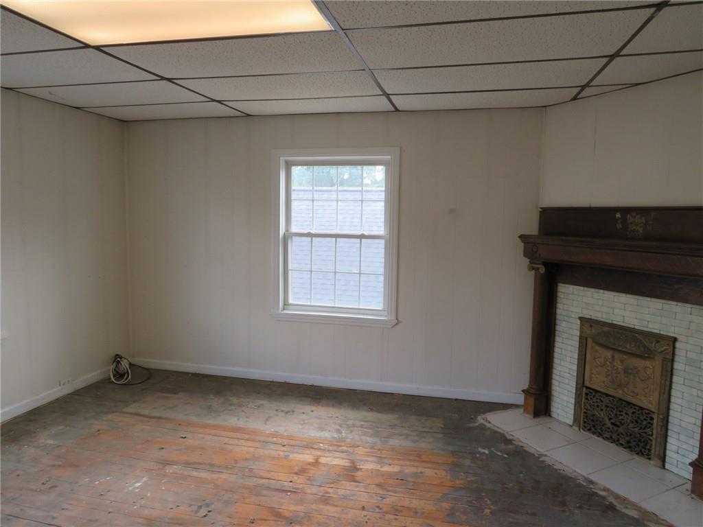 802 Howard Street Monongahela, PA 15063 - Photo 29 of 43 a view of an empty room with a fireplace and a window