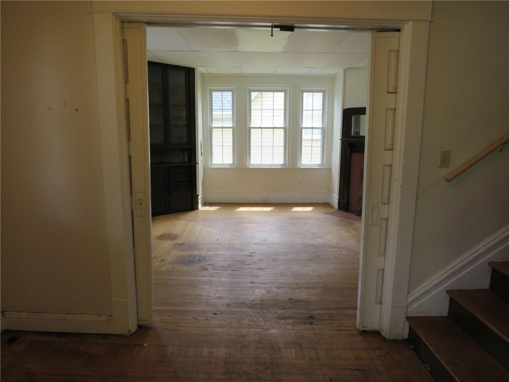 802 Howard Street Monongahela, PA 15063 - Photo 4 of 43 a view of an empty room with wooden floor and a window