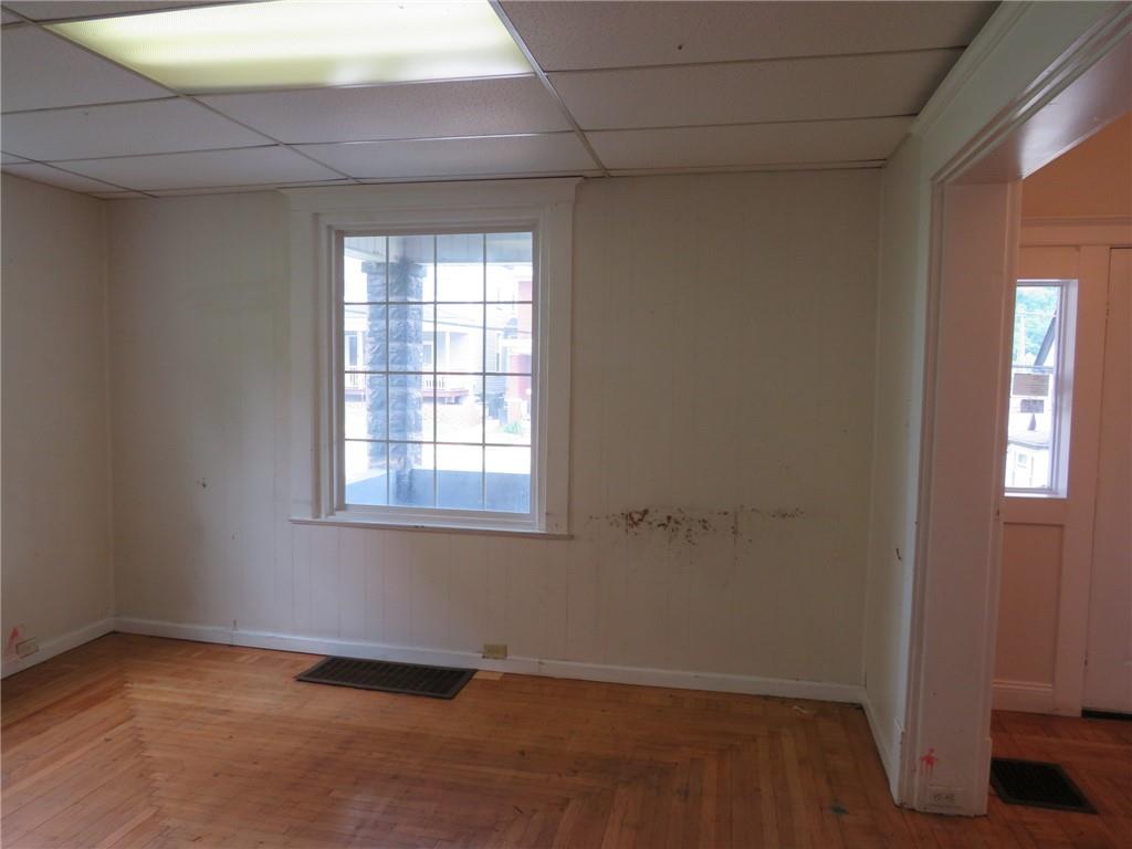 802 Howard Street Monongahela, PA 15063 - Photo 10 of 43 an empty room with wooden floor and windows