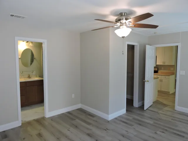 a view of a bathroom with a sink and a mirror