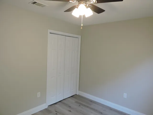 a view of backyard with plants and outdoor seating