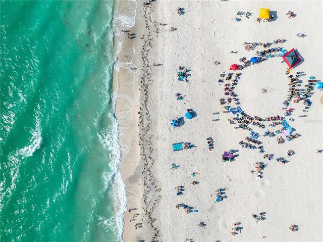 an aerial view of a city with lawn chairs