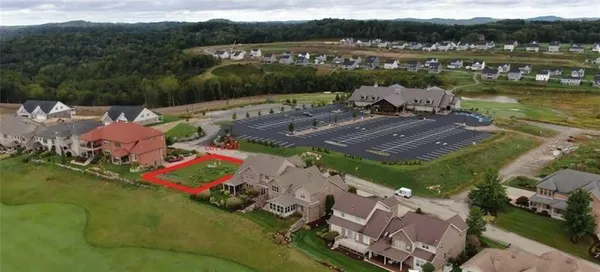 an aerial view of a house with a lake view