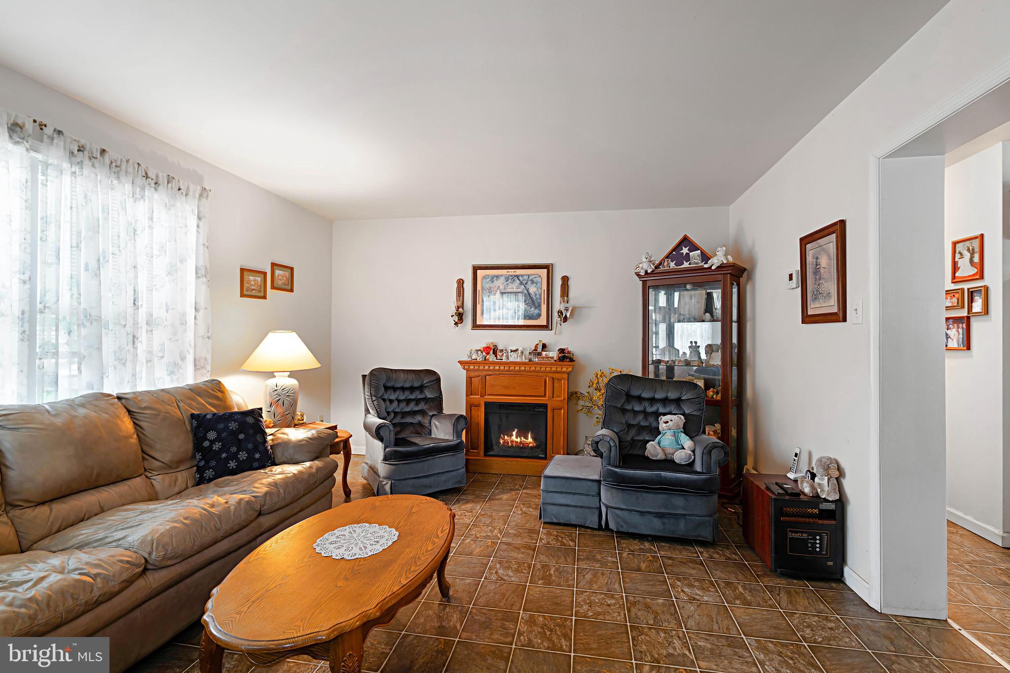 315 Beech Road Millville, NJ 08332 - Photo 9 of 21 a living room with furniture and a fireplace