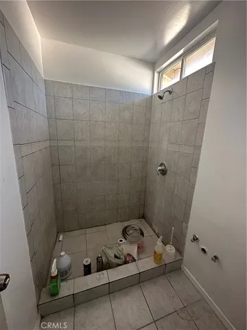 a bathroom with a bathtub and shower