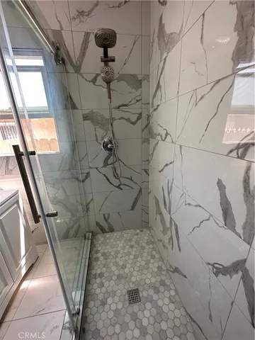 a picture of a bathroom with a shower