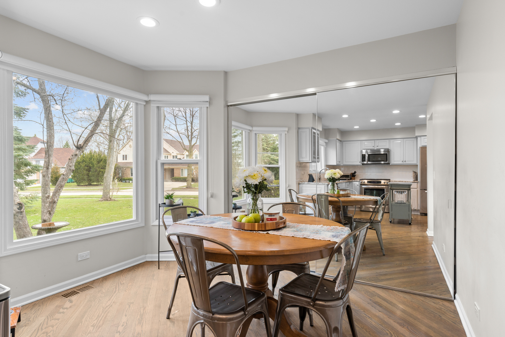 607 Raintree Road Buffalo Grove, IL 60089 - Photo 11 of 27 a dining room with furniture window and wooden floor