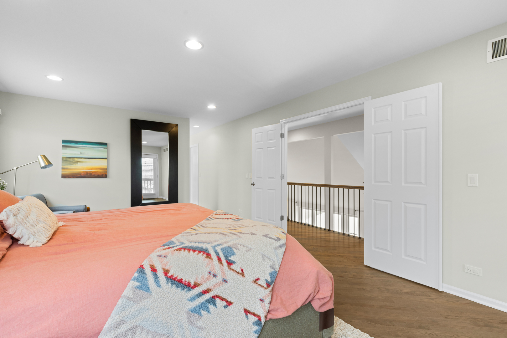 607 Raintree Road Buffalo Grove, IL 60089 - Photo 14 of 27 a bedroom with a bed and wooden floor