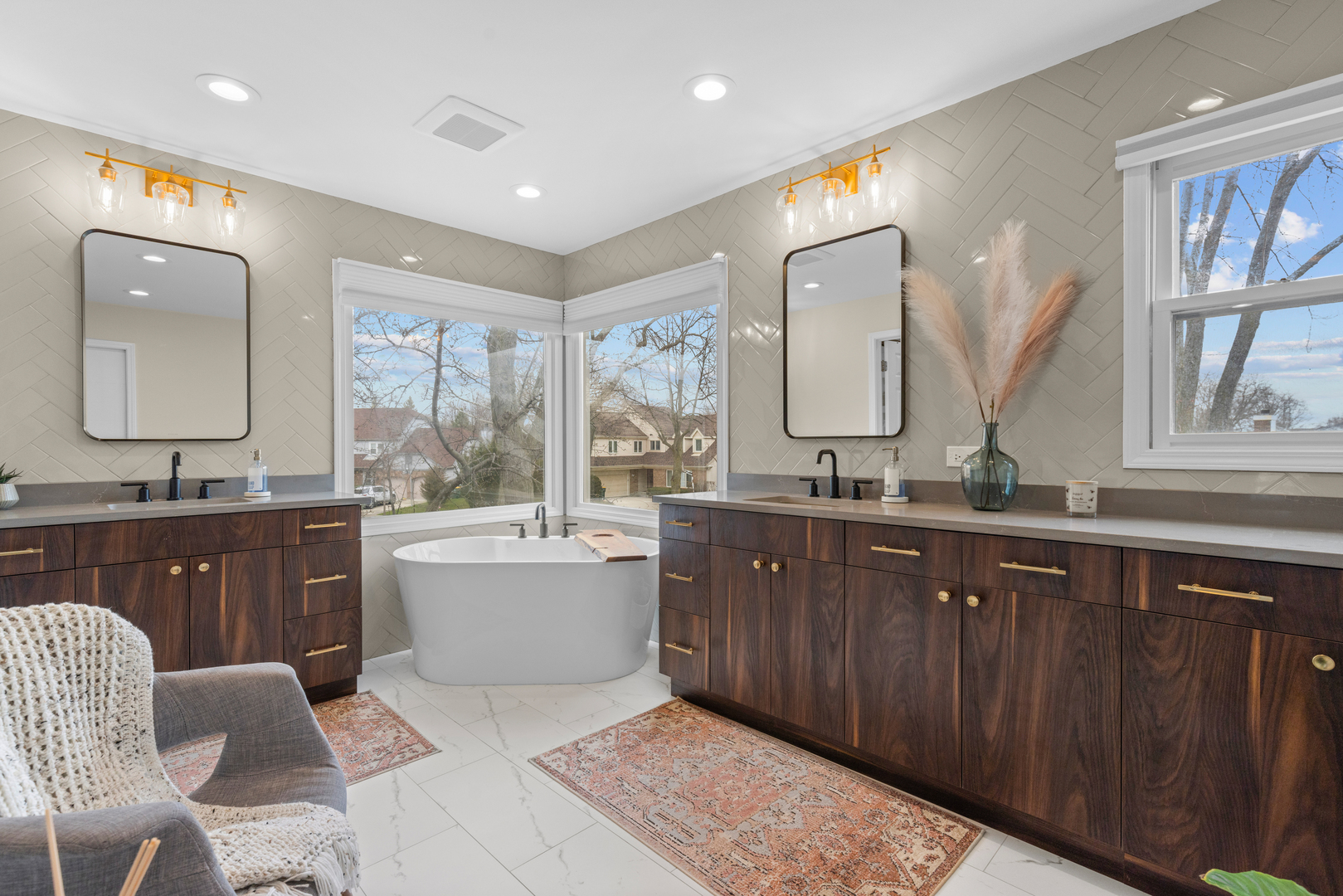 607 Raintree Road Buffalo Grove, IL 60089 - Photo 15 of 27 a spacious bathroom with a granite countertop tub sink and mirror