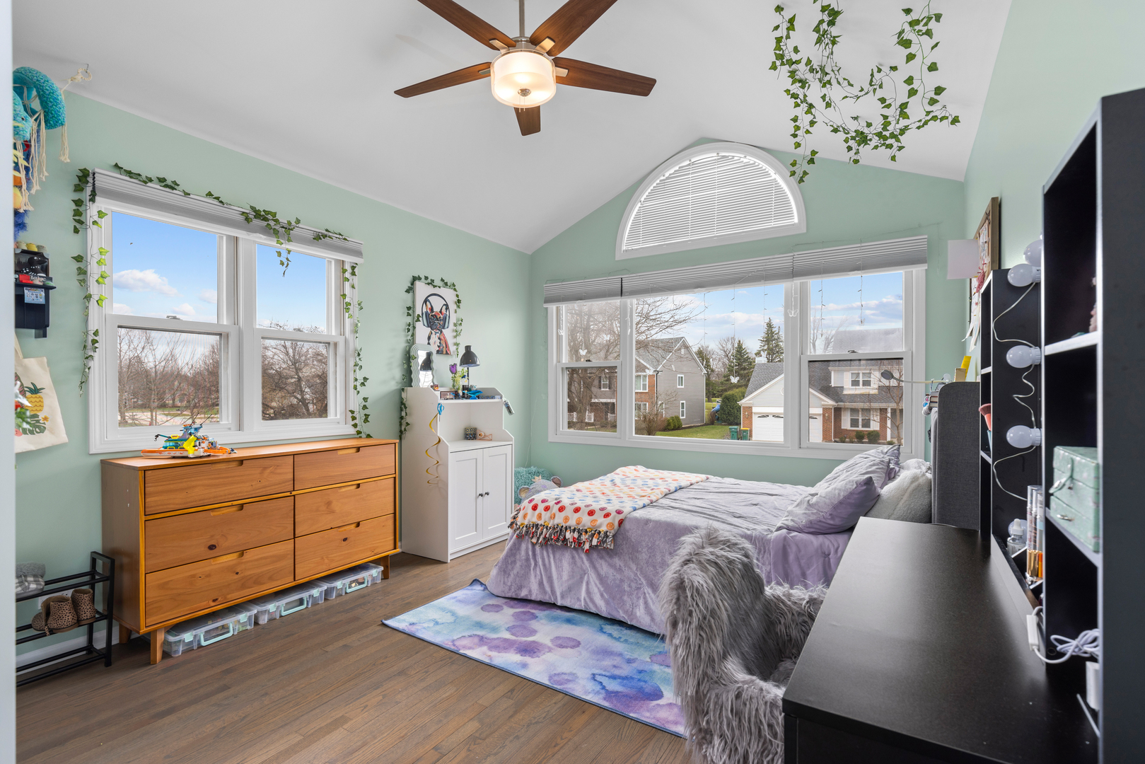 607 Raintree Road Buffalo Grove, IL 60089 - Photo 17 of 27 a living room with furniture large window and wooden floor