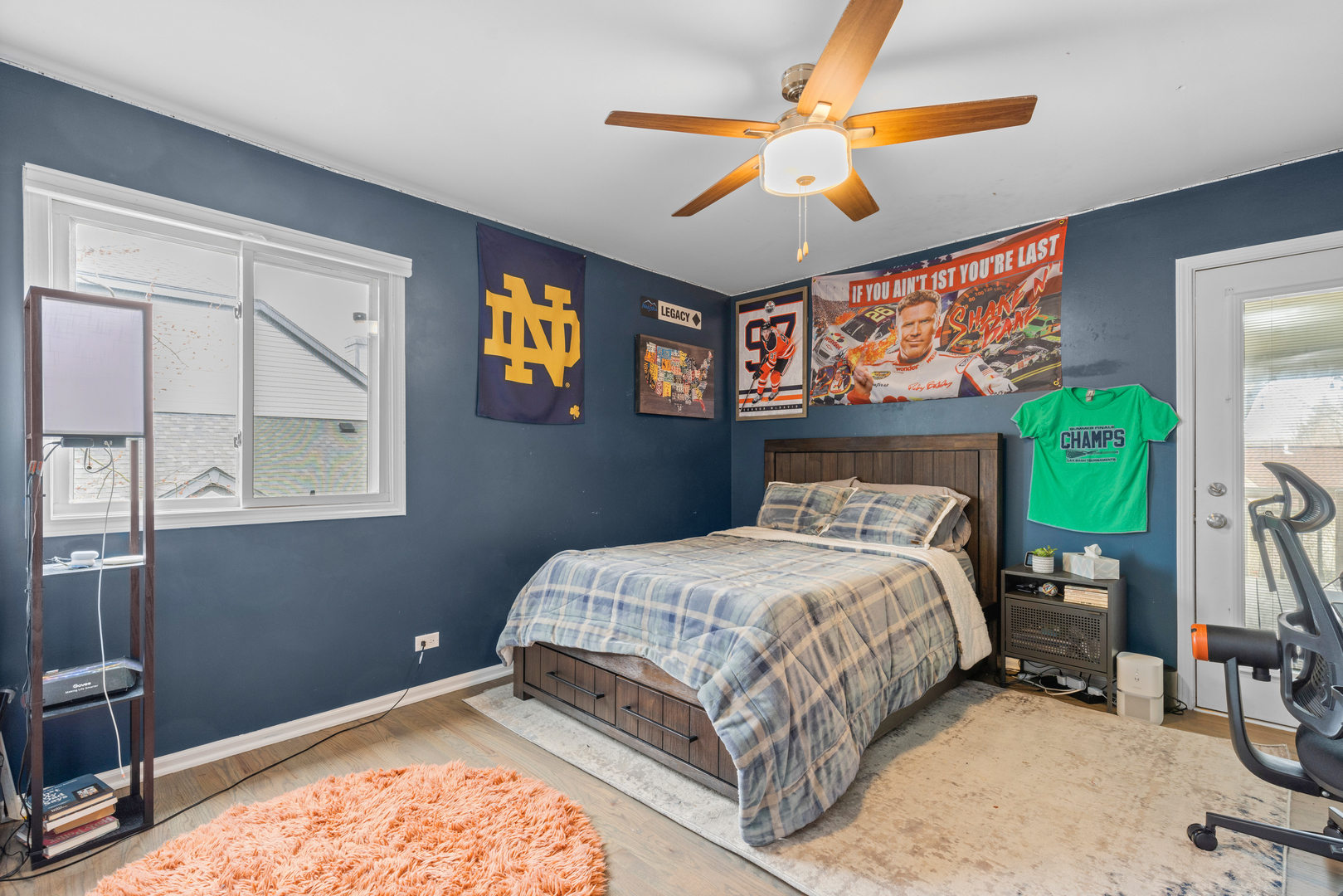 607 Raintree Road Buffalo Grove, IL 60089 - Photo 19 of 27 a bedroom with a bed and a chandelier